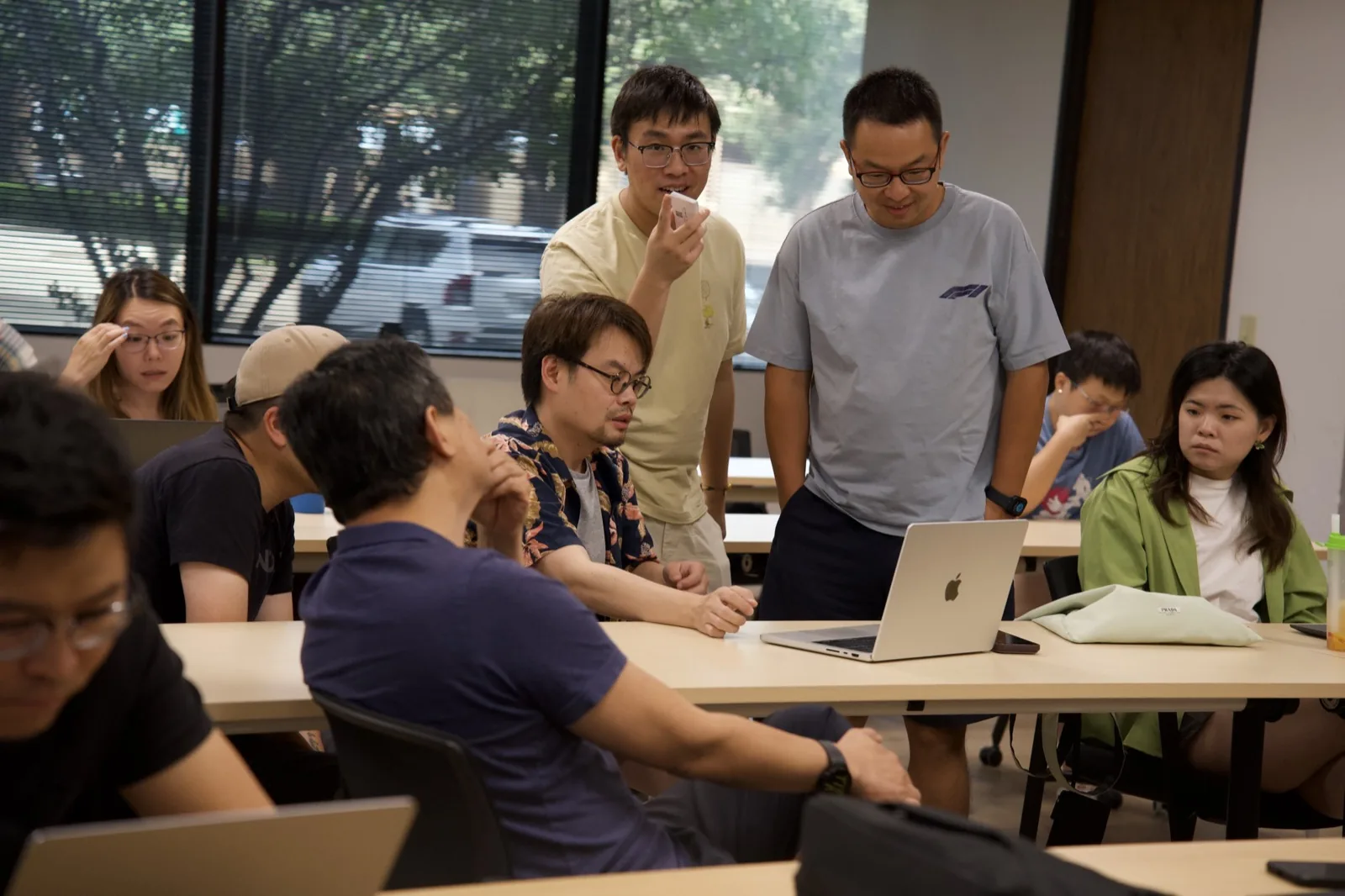 A group demo at the AI workflow automation session in Dallas, July 18, 2026